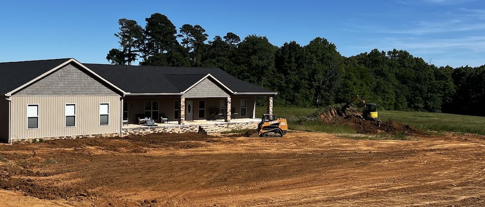New home site graded and prepped for outdoor living construction near Dyersburg, TN